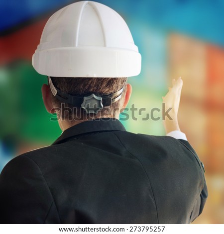 Businessman with building helmet