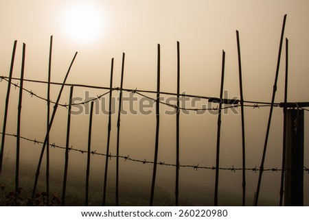 Silhouette fence with the light of the sun