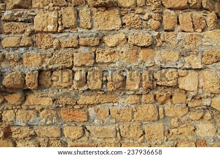 Background grunge texture of wall ruins in Caesarea Maritima National Park, a city and harbor built by Herod the Great about 25-13 BC. The archaeological ruins are on the Mediterranean coast of Israel