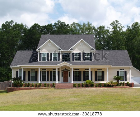 Two story residential home with with board siding on the facade.