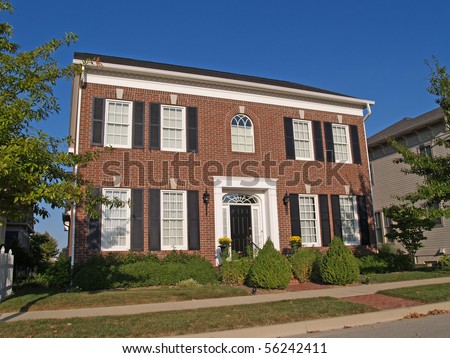 Large two story new brick home built to look like an old historical home.