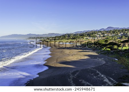 Moonstone Beach after King / High tide.Shame Park, Park Hill, & Santa Rosa Creek Estuary can be seen in the background, on California-Central-Coast, near Cambria CA