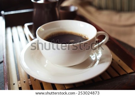 In the afternoon, black coffee, White cup ,soft relaxing.