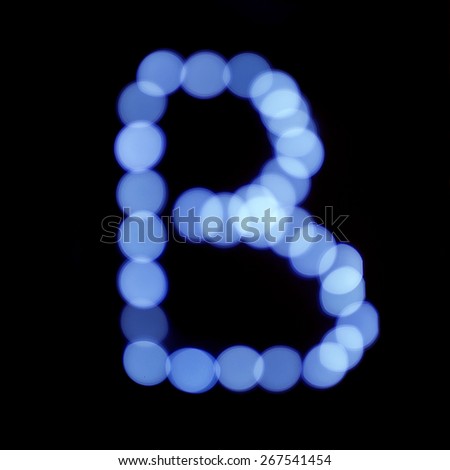 letter of Christmas lights on a dark background, the letter B, 