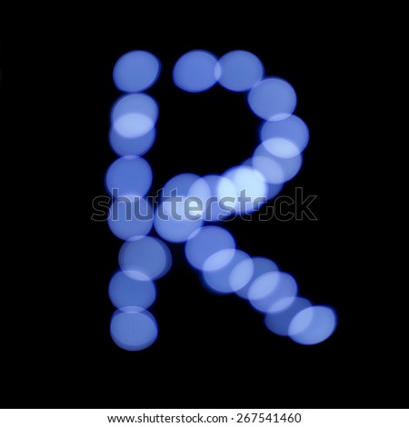 letter of Christmas lights on a dark background, the letter R, \