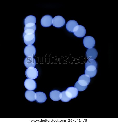 letter of Christmas lights on a dark background, the letter D, \