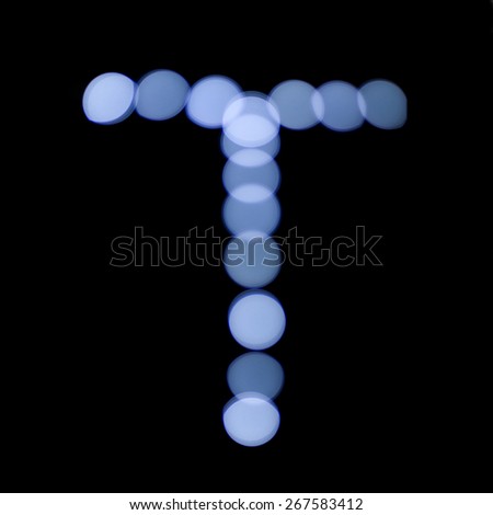 letter of Christmas lights on a dark background, the letter T, \