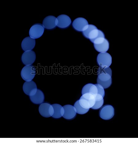 letter of Christmas lights on a dark background, the letter Q, \