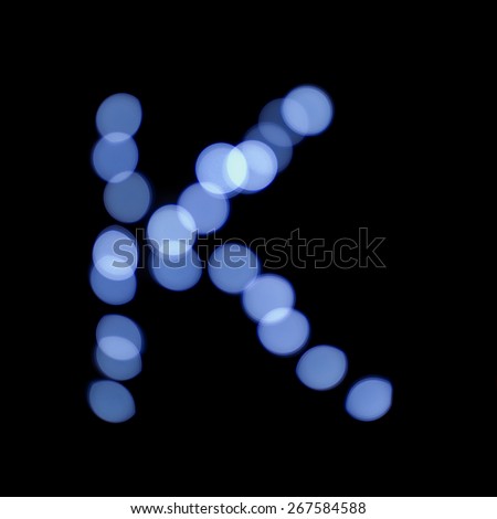 letter of Christmas lights on a dark background, the letter K, \