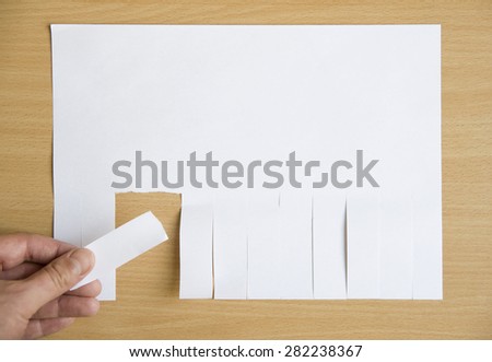 hand tear paper from blank advertising posted on wooden billboard and marked with your own message