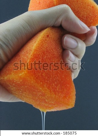 Left Hand Squeezing Orange Sponge