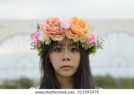 Portrait of  beautiful young woman with roses and flower in her hair. Cosmetics. Beauty, fashion.