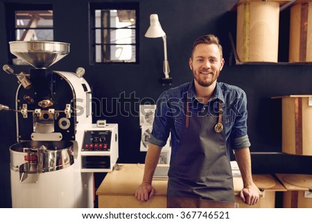 Entrepreneur in his modern coffee roastrery and distribution spa