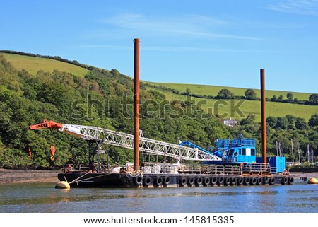 Crane boat on the River Dart