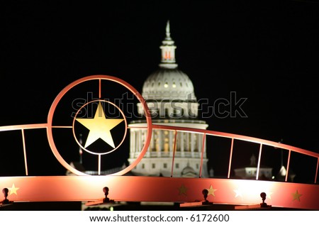 shot of the star of Texas with the Texas State Capitol Building in