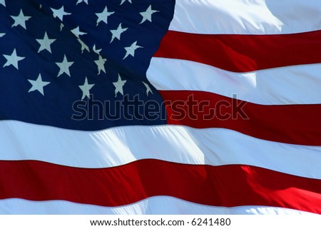 An American flag flaping boldly in the wind.