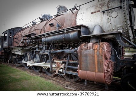 an old steam train at a train depot museum