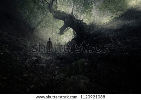 scary forest scene with old tree and mysterious ghostly figure, gothic landscape