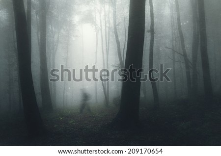 ghost in a spooky dark forest on halloween with grunge texture