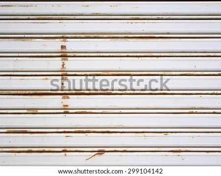 Rusty and lowered rolling shutter with parallel lines.