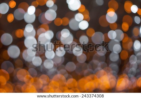 Abstract background defocused orange and white lights