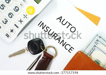 Auto insurance with car key, money in wallet and calculator