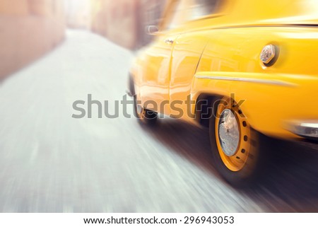 Yellow fast taxi car driving very fast