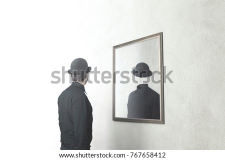 identity absence surreal concept; man in front of mirror reflecting himself without face