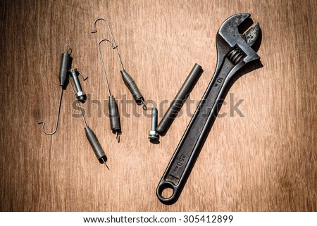 Engineering Hand Tools, Spanner wrench, Coil Spring and Set Screw on wood sheet
