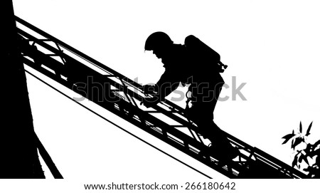 Silhouette of a Firefighter Climbing a Staircase
