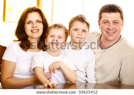 happy family indoor; shallow DOF, focus on mother eyes