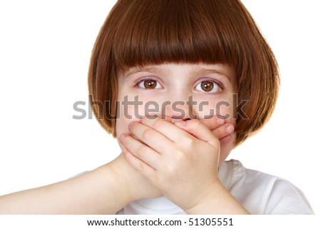 closeup portrait of little girl with hands over mouth