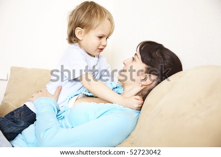 mother with her little son playing; indoor