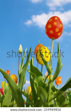 Happy Easter, funny tulips, tulips with special flower heads against blue sky, composing