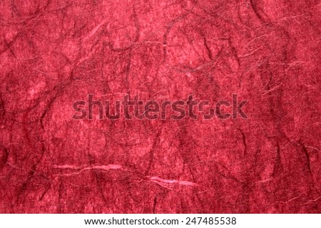 Dark red rice paper background.