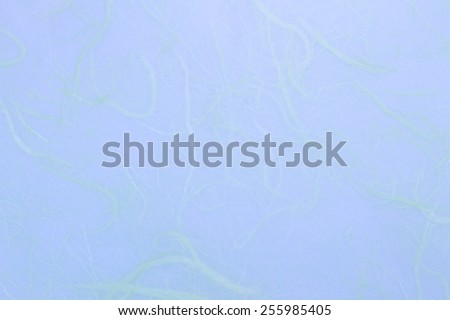 Backgrounds & textures shop. Paper background - texture of blue rice paper. Homogeneous light.