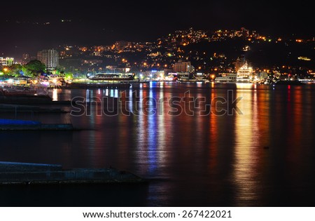 Mountains city at night. Black sea in Crimea