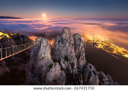 Beautiful night landscape with full moon, sea, rocks and clouds at autumn. Mountain Ai-Petri. Night, Full Moon. Crimea