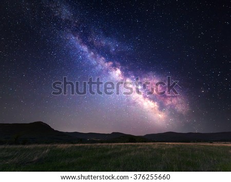 Landscape with Milky Way. Night sky with stars at mountains.