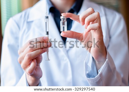 Syringe and ampule, bottle, medical injection in hand, palm or fingers. Medicine plastic vaccination equipment with needle. Nurse or doctor. Liquid drug or narcotic. Health care in hospital.