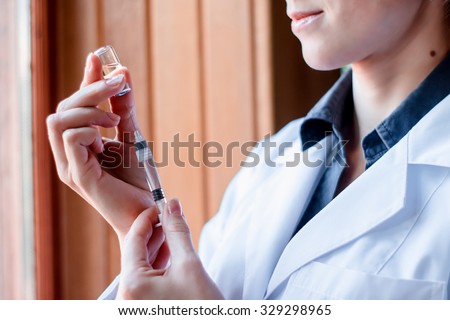 Syringe and ampule, bottle, medical injection in hand, palm or fingers. Medicine plastic vaccination equipment with needle. Nurse or doctor. Liquid drug or narcotic. Health care in hospital.