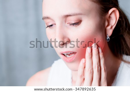 Toothache, dental pain. Health problem, illness. Tooth ache. Young or adult person, people. Painful mouthe. Facial expression. Medical, medicine sickness. One face, portrait.