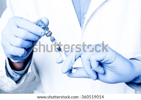 Syringe, medical injection, bottle, ampule in hand, palm or fingers. Medicine plastic vaccination equipment with needle. Nurse or doctor. Liquid drug or narcotic. Health care in hospital.