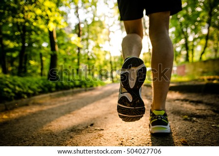 Marathon run shoe. Outdoor workout. Sport athlete, runner training. Athletic fitness exercise. Young yogger leg, fit. Healthy lifestyle. Active people wellbeing.