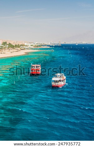 Two pleasure boats in the Red Sea off the coast of Israel