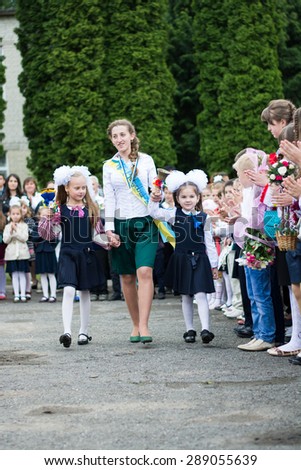 YAMPIL, LVIV/UKRAINE   MAY 29 2015: The solemn event in honor of the academic year finishing (last bell). Children have last call
