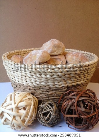 Bread on hamper with balls on White table