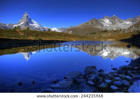 Mountain Matterhorn with mirror reflections in lake Leisee, Sunnegga, Zermatt