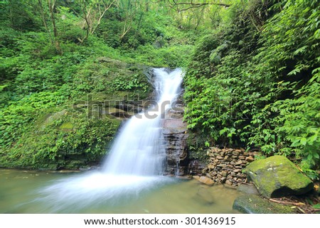 Waterfall in a secret ravine~Cool refreshing waterfall hidden in a mysterious forest of lush greenery