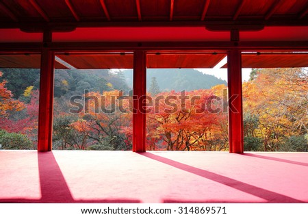 View from a Japanese tea ceremony room toward the autumn mountains with maple trees in Kyoto